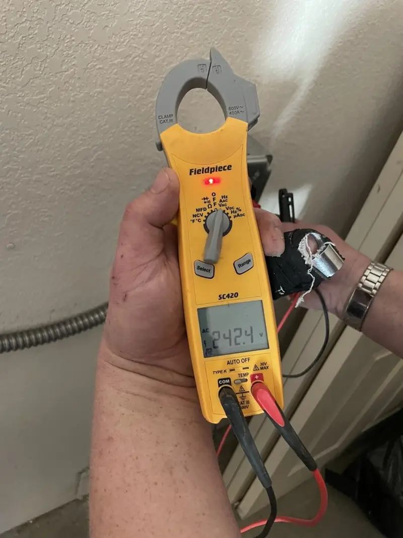 Voltage testing with clamp meter during Electrical Installation Services in Tyrone